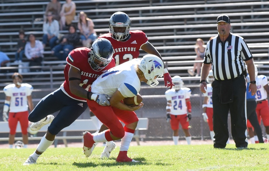 #11 Ryan Ten Hulscher of College of the Siskiyous football team, tackles a player form West Hills College during a home game on Saturday, Oct. 2, 2021.